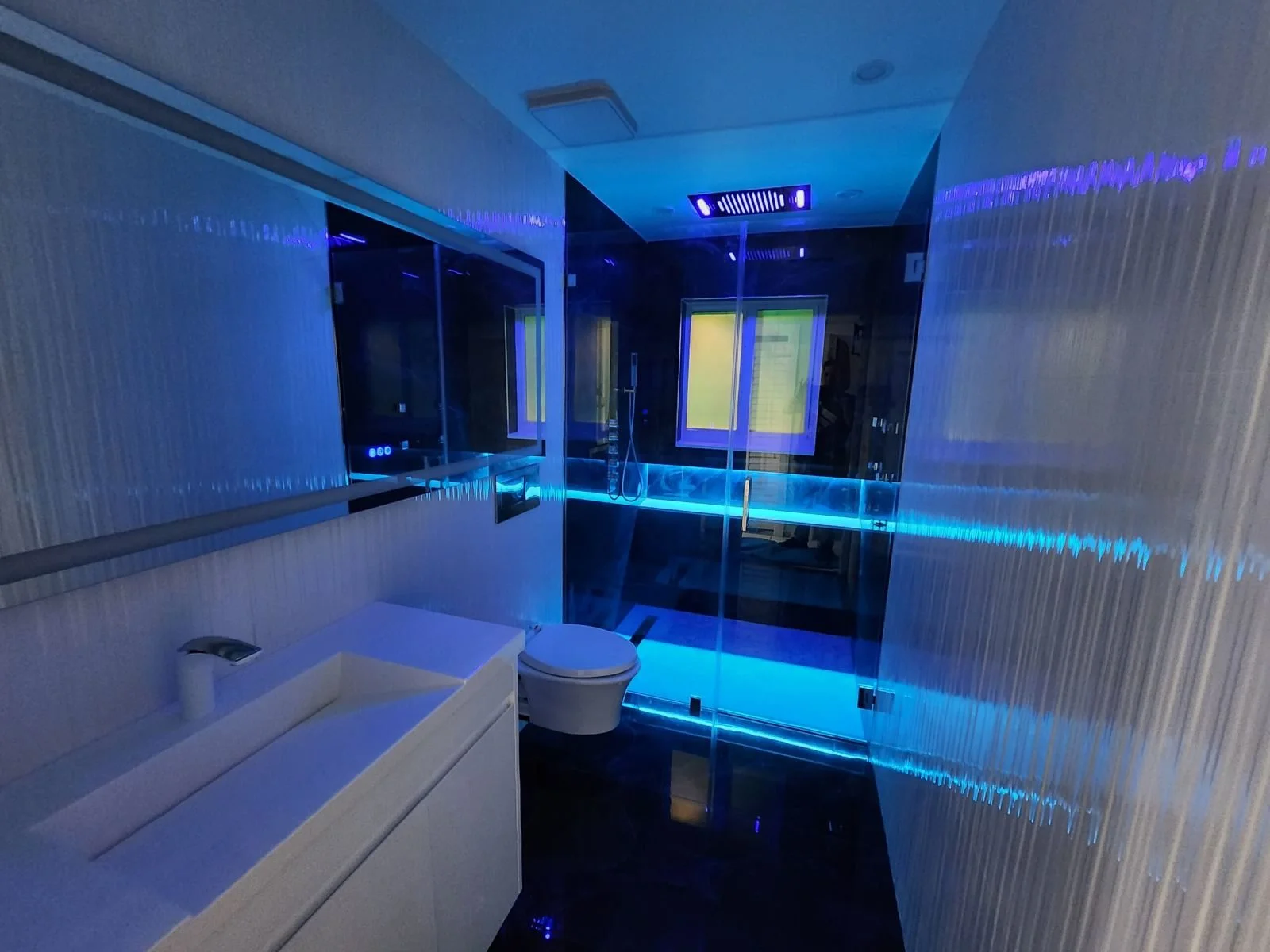 Modern bathroom renovation Miami blue white